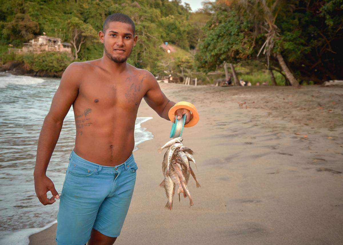 Alex Escobar, 21, is pleased with his morning fishing. Still, he didn’t catch jurel, an elusive fish that would give him a chance to make decent money.