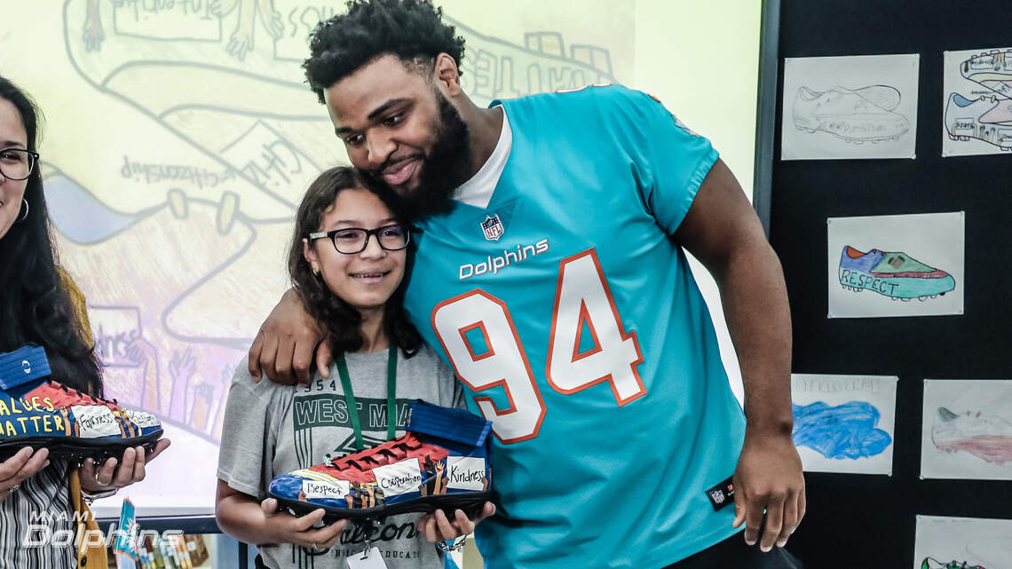 Miami eighth-grader won NFL cleat design contest. This Dolphin will wear her shoes.