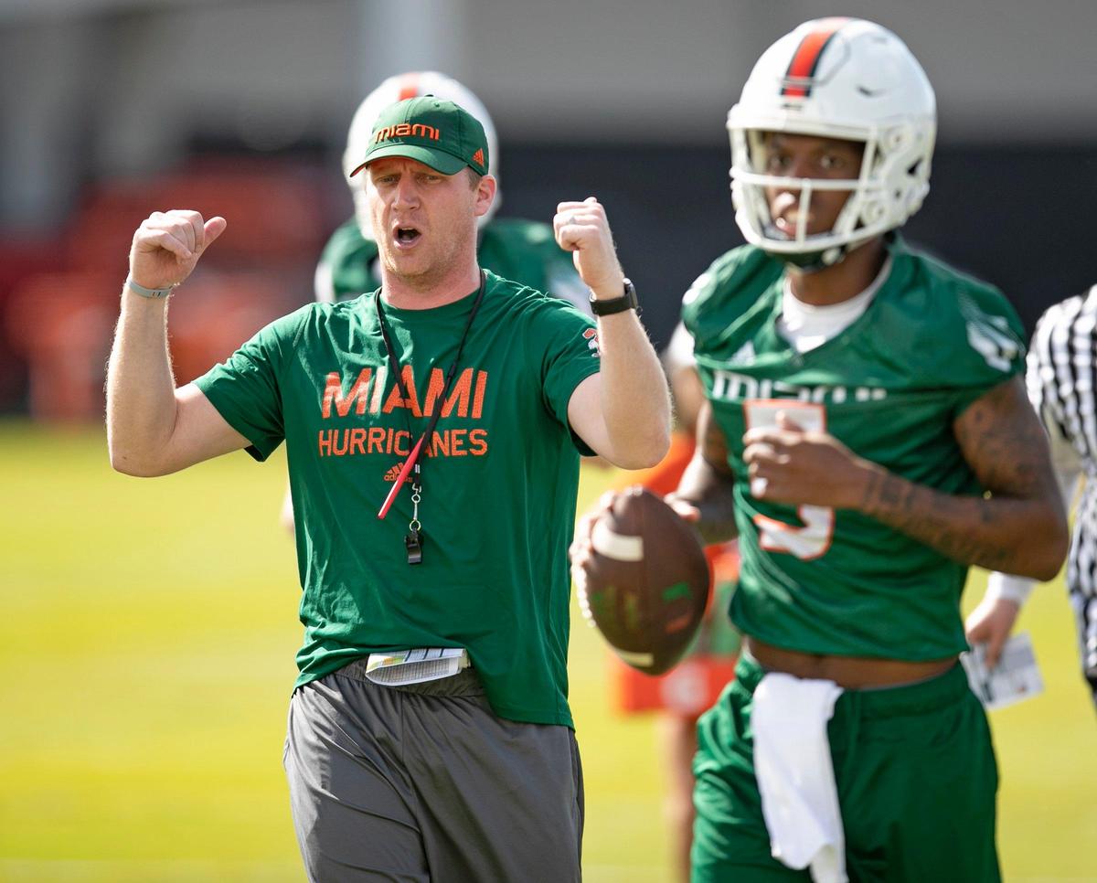 Miami Hurricanes offensive coordinator and quarterbacks coach Rhett Lashlee gestures during practice at the University of Miami’s Greentree Field in Coral Gables on Monday, March 2, 2020.