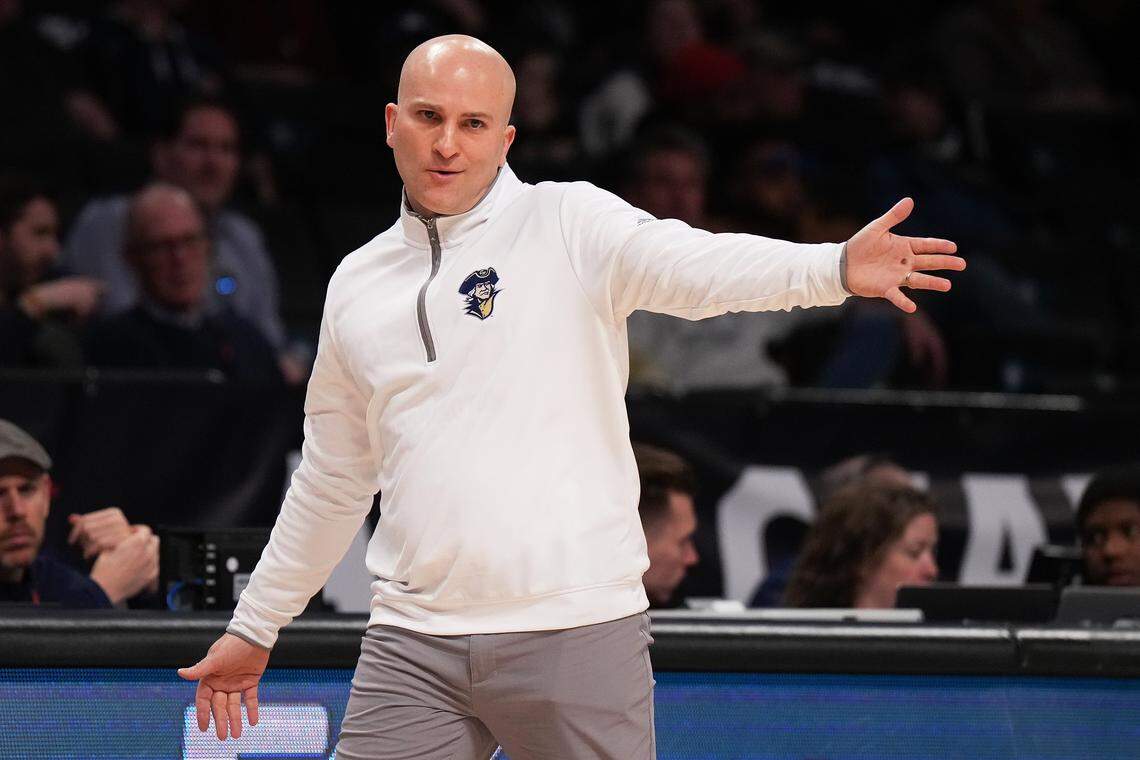BROOKLYN, NEW YORK - MARCH 08: head coach Chris Caputo of the George Washington Colonials  looks on from the bench against the Saint Joseph's Hawks in the first half during the Second Round of the A10 Basketball Tournament at Barclays Center on March 08, 2023 in Brooklyn, New York. (Photo by Mike Stobe/Getty Images)