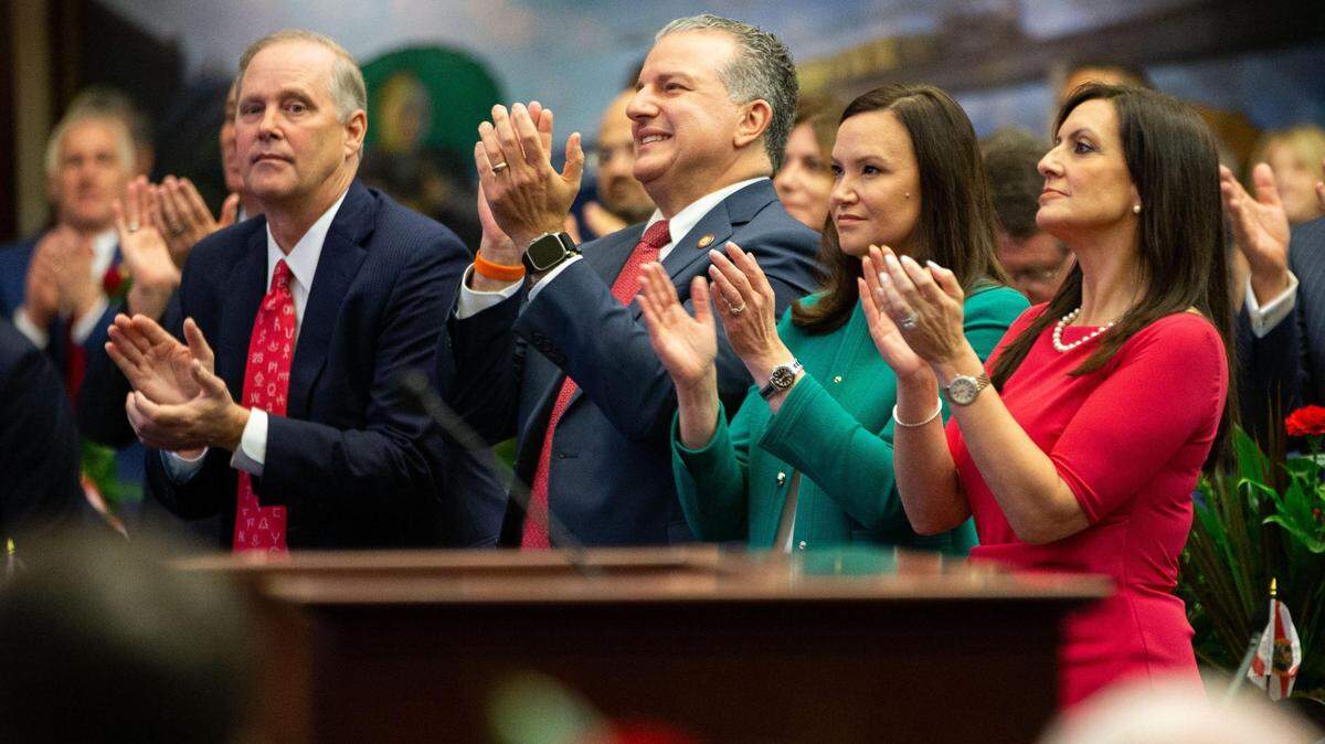 Commissioner of Agriculture Wilton Simpson, left, CFO Jimmy Patronis, Attorney General Ashley Moody and Lt. Gov. Jeanette Nuñez applaud Gov. Ron DeSantis during his State of the State Address on opening day of the 2023 Florida legislative session on March 7.