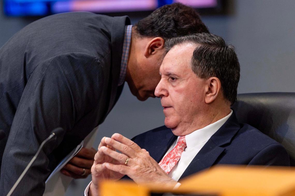 Commissioner Joe Carollo listens to an aide as public comment commences during a City Commission meeting on Tuesday, June 17, 2025, in Miami.