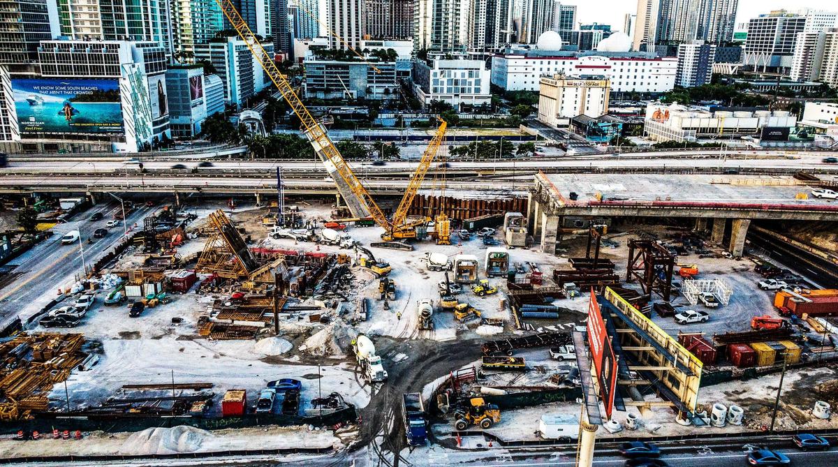Southeast view of ongoing construction of two arches and the center pier footer for the I-395 signature bridge as part of the I-395/SR 836/I-95 Design-Build Project, on Wednesday, Aug. 3, 2022.