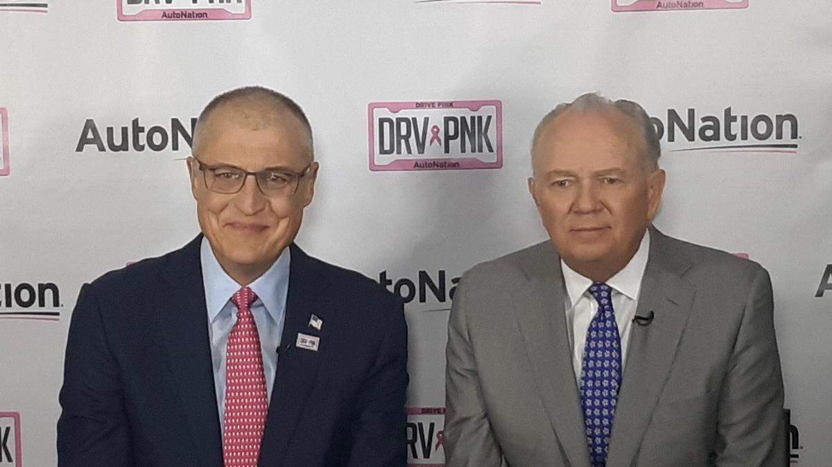 Outgoing AutoNation chairman, president and CEO Mike Jackson, right, with Carl Liebert, incoming CEO.