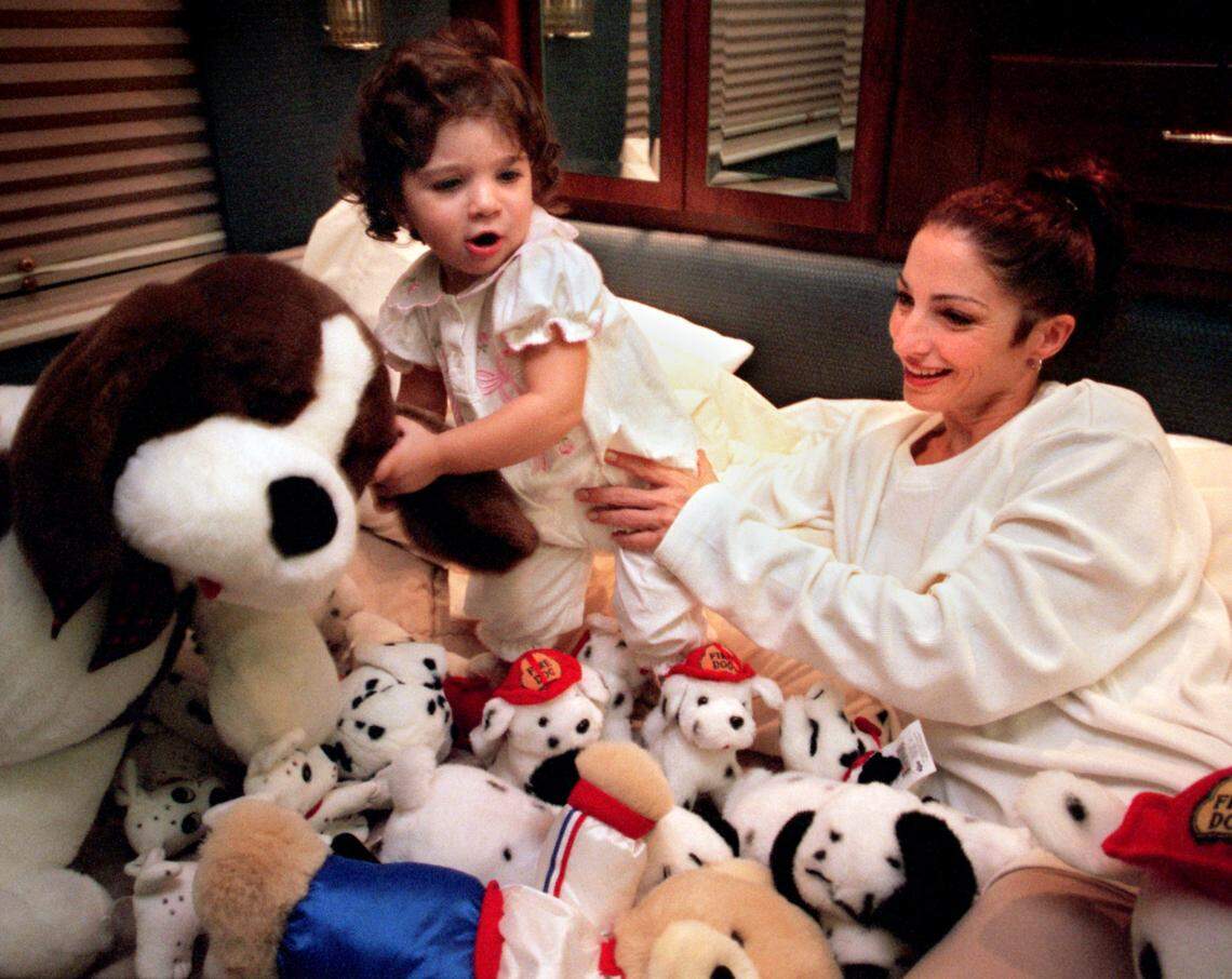 On the tour bus after a 1996 concert, Gloria Estefan and daughter Emily go through some of the stuffed animals that were given to them during the show earlier that night in Pittsburgh.