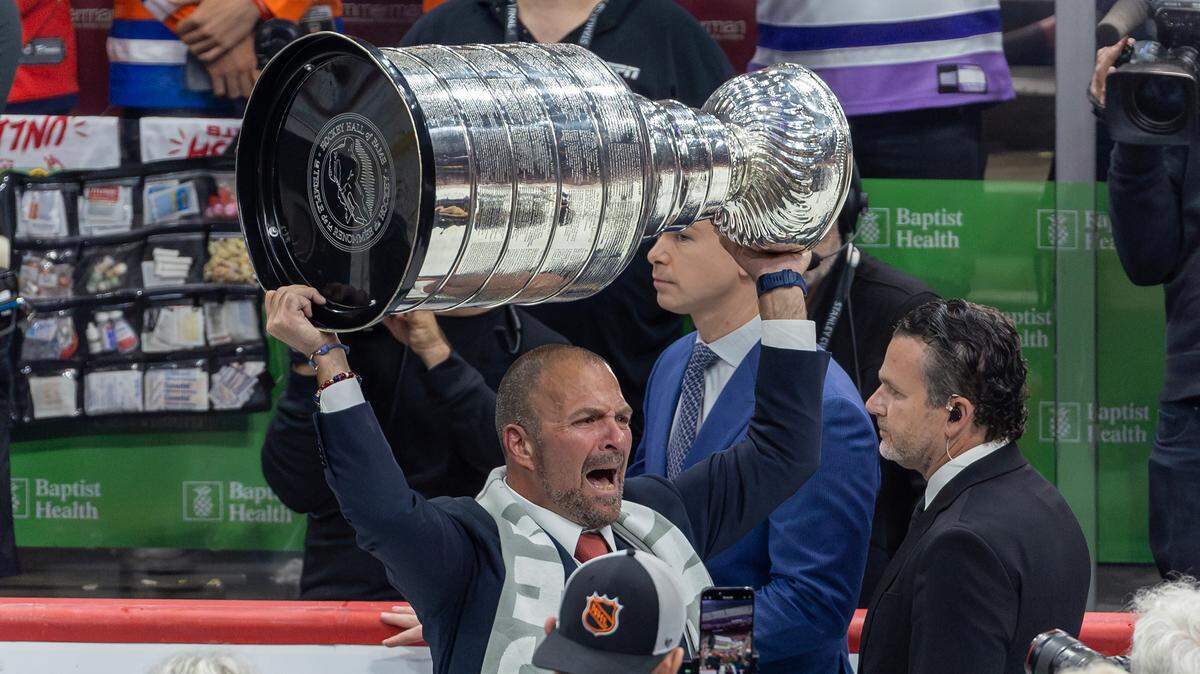 Florida Panthers General Manager, President of Hockey Operations Bill Zito lifts the Stanley Cup after the Panthers defeated the Edmonton Oilers in Game 7 of the NHL Stanley Cup Final at the Amerant Bank Arena on Monday, June 24, 2024, in Sunrise, Fla.