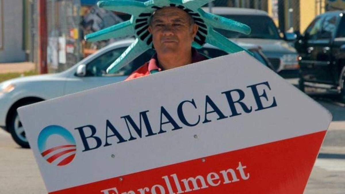 In this 2015 file photo, a man in a Statue of Liberty costume advertises Affordable Care Act coverage in Little Havana. The deadline to sign up for 2019 coverage is midnight Dec. 15. Eligible consumers can sign up online at healthcare.gov or by calling 800-318-2596.