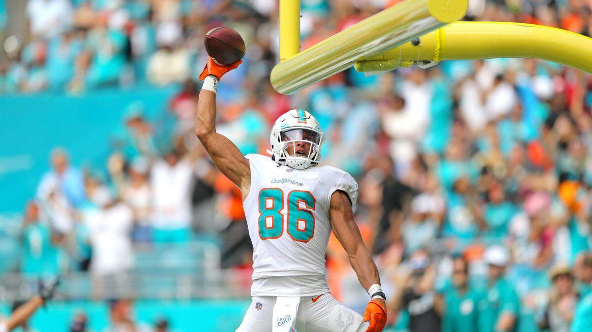 Miami Dolphins wide receiver Mack Hollins (86) dunks the football on the goal post after scoring during fourth quarter of an NFL football game against the Atlanta Falcons at Hard Rock Stadium on Sunday, October 24, 2021 in Miami Gardens, Florida.