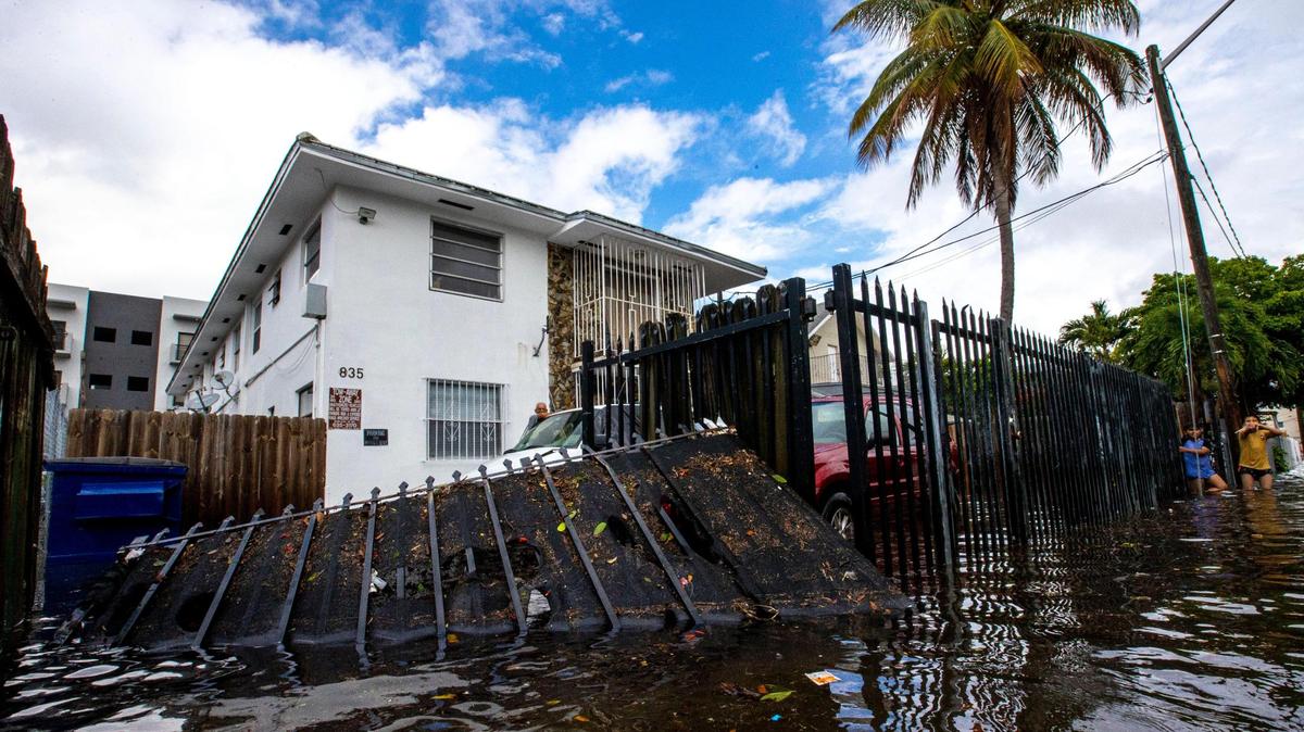 A house surrounded by floodwaters on Southwest Third Street in the Little Havana neighborhood of Miami, Florida, on Saturday, June 4, 2022.