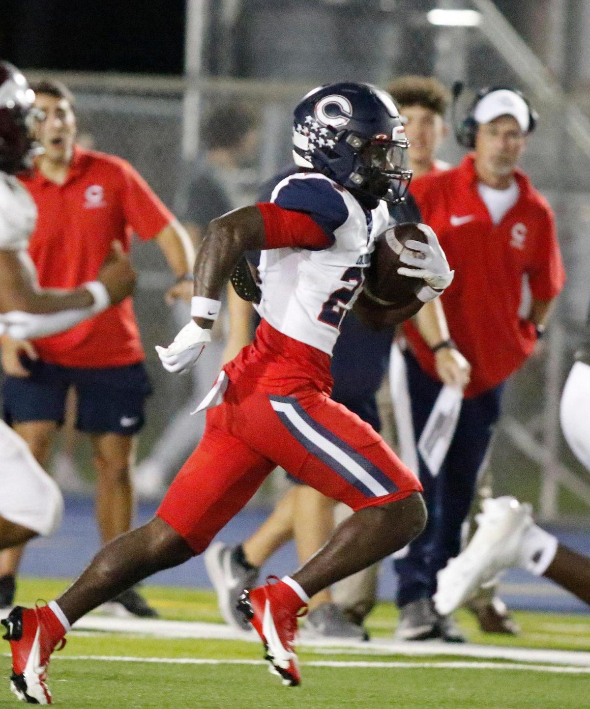 Columbus Explorers Shaddai Carter (27) gains yardage during the football game against Norland Vikings on Friday, October 20, 2023 at Traz Povewll Stadium in Miami. Andrew Uloza / for Miami Herald
