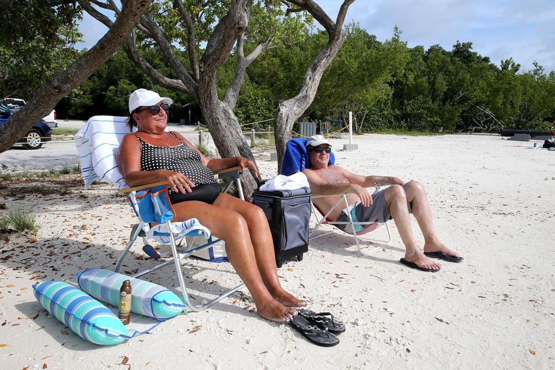 Broward resident Gloria Metin sits on the beach at John Pennekamp State Park in Key Largo, Florida, June 1, 2020. The Florida Keys reopened to tourist after being closed because of the coronavirus outbreak. Metin was one of first to arrive in the keys.