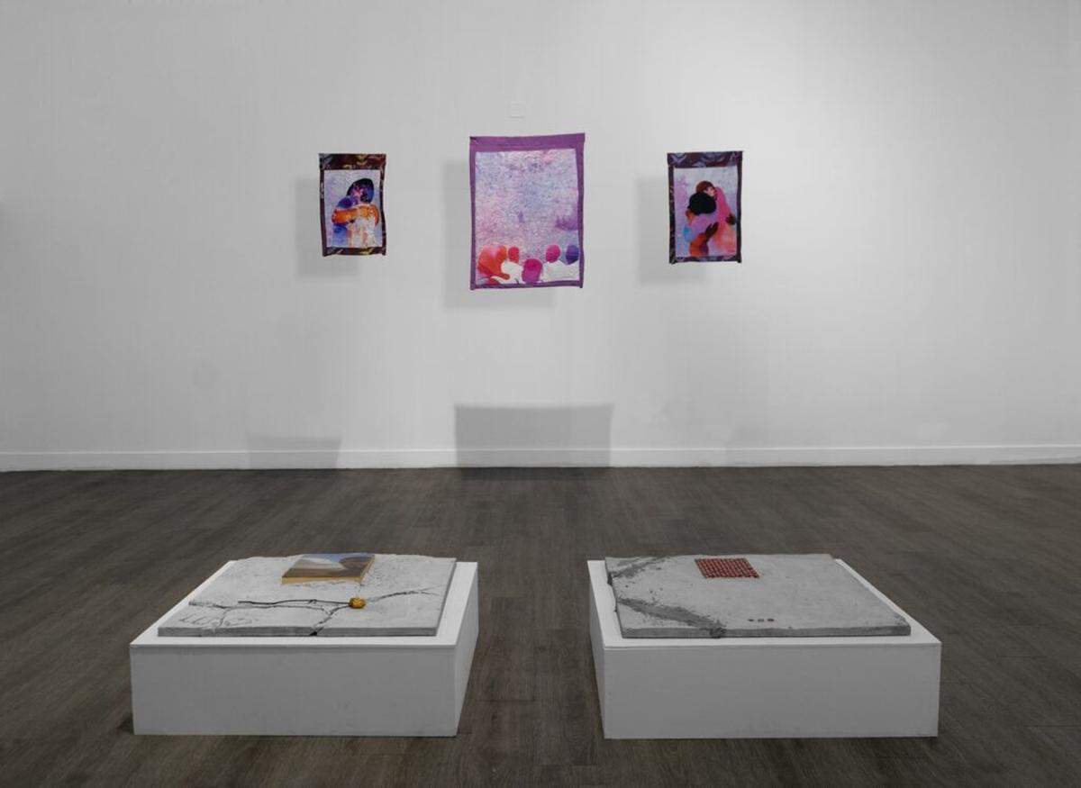 Reginald O’Neal explored concrete as a material for the first time for his work in “Suns + Shadows.” Mark Fleuridor’s work can be seen on the wall.