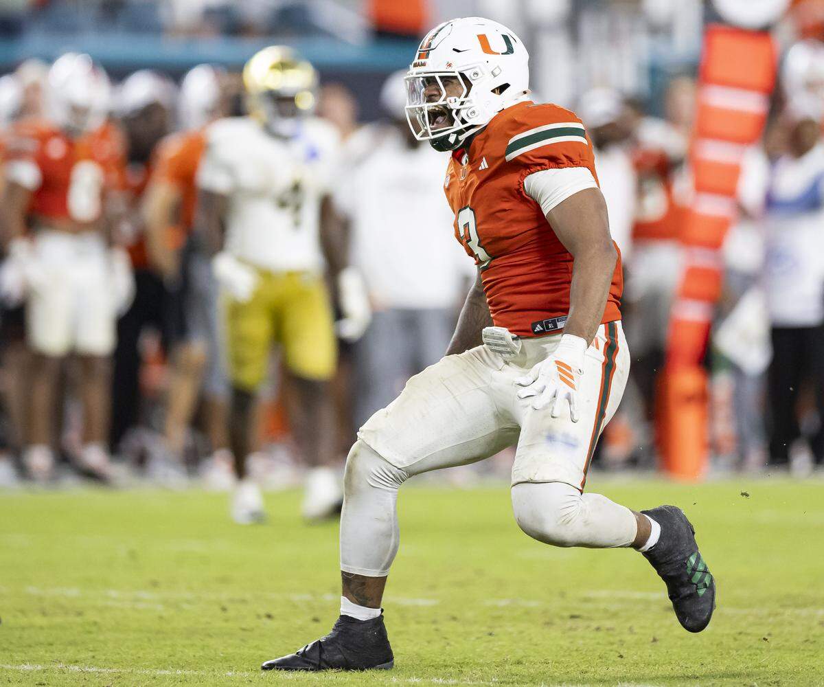 Miami Hurricanes defensive lineman Akheem Mesidor (3) reacts after he sacked Notre Dame Fighting Irish quarterback CJ Carr (13) in the second half of their NCAA football game at Hard Rock Stadium on Sunday, Aug. 31, 2025, in Miami Gardens, Fla.