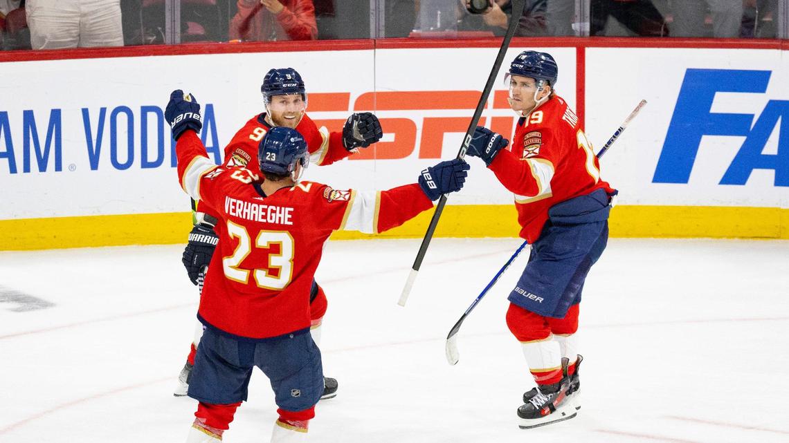 Florida Panthers center Carter Verhaeghe (23) and Florida Panthers center Sam Bennett (9) celebrate a goal by Florida Panthers left wing Matthew Tkachuk (19) with him during the third period of Game 1 of the Stanley Cup Playoffs Round 1 on Sunday, April 21, 2024, at Amerant Bank Arena in Sunrise, Fla. The Florida Panthers won 3-2.