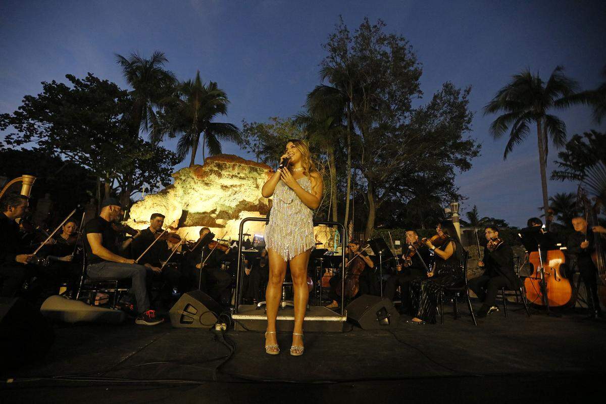Singer Zesi performs during a centennial concert at the soon-to-reopen Venetian Pool in Coral Gables, Florida, on Sunday, Dec. 7, 2025, as Maestro Eduardo Marturet leads the Miami Symphony Orchestra.