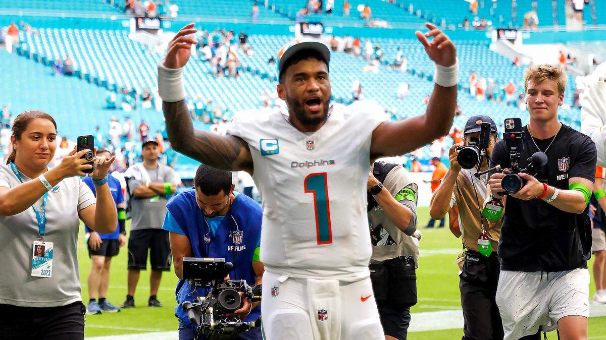 Miami Dolphins quarterback Tua Tagovailoa (1) celebrates after the Dolphins defeated the Denver Broncos 70-20 during an NFL football game at Hard Rock Stadium on Sunday, Sept. 24, 2023 in Miami Gardens, Fl.