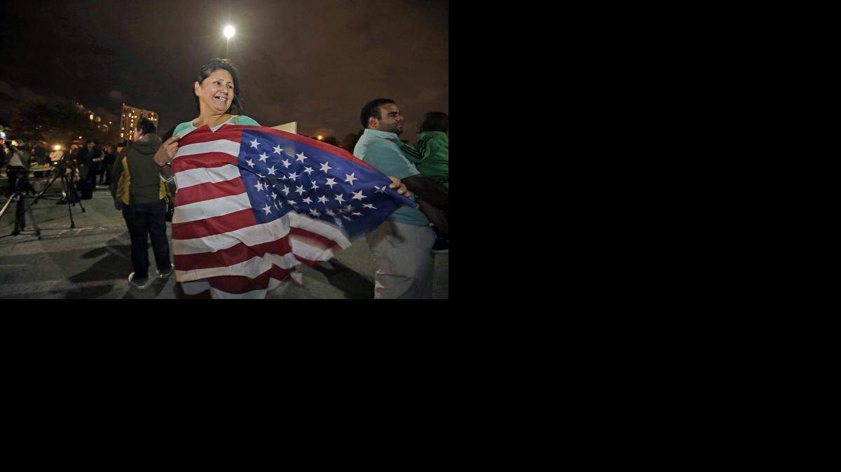
JOYOUS: Viviana Ivalo, from Argentina, celebrates after hearing President Obama announce his executive action on immigration at the Florida Immigrant Coalition in Miami, on Nov. 20, 2014.
