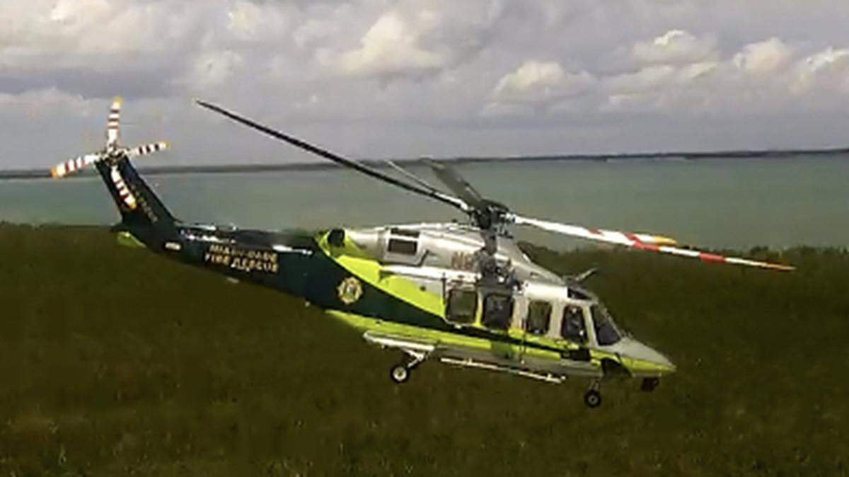 A Miami-Dade County Fire Rescue helicopter lifts off from the 18 Mile Stretch of U.S. 1 near Key Largo Thursday, March 30, 2023, after picking up a person injured in a boating accident.