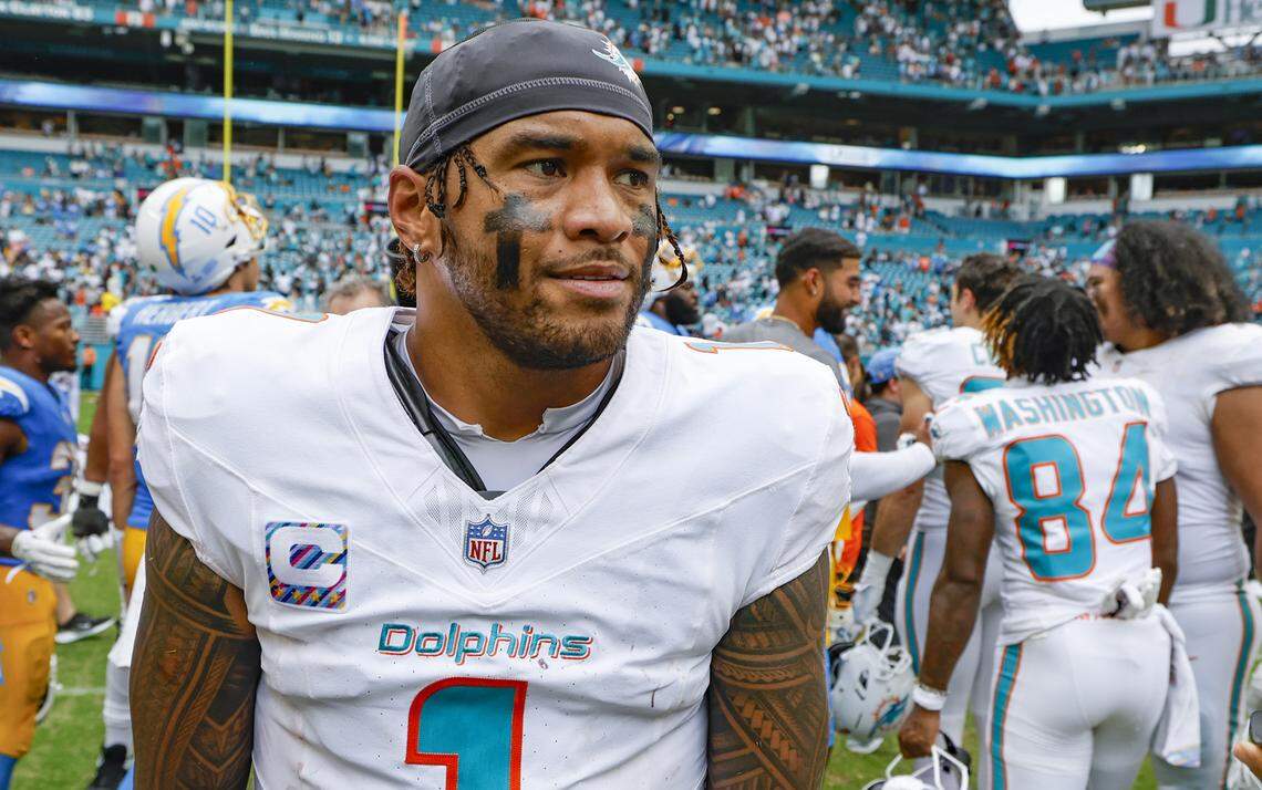 Miami Dolphins quarterback Tua Tagovailoa (1) walks off the field after the Los Angeles Chargers defeat the Dolphins during their NFL football game at Hard Rock Stadium in Miami Gardens, FL, on Sunday, October 12, 2025.