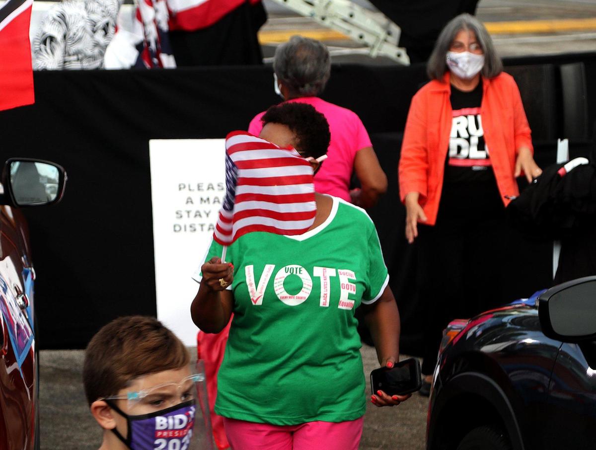 Supporters of VP Joe Biden, gathered around their cars during a drive-in car rally held by U.S. Senator Kamala Harris, running mate of Democratic presidential nominee Joe Biden held at FIU South Campus in Miami as she campaigns ahead of November 3rd Election Day in South Florida on Saturday, October 31, 2020