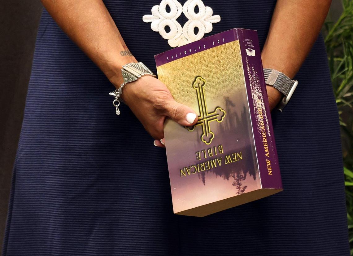 Judy Licata holds the Bible that was used for the swearing in of her husband Peter B. Licata as the superintendent of Broward County Public Schools at the Kathleen C. Wright Administration Center’s boardroom in Fort Lauderdale, Florida on Tuesday, July 18, 2023.