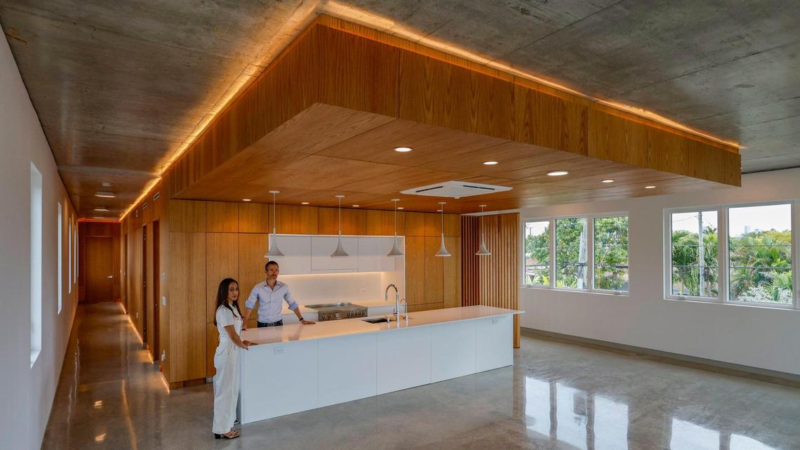Co-founder’s Nathalie Manzano and Ted Caplow stand in the kitchen area of their newly constructed house in the Miami neighborhood of Silver Bluff on Thursday, April 4, 2024. The house landed one of the highest honors in architectural design. It is the first in the world to become an International Well Building Institute-certified house.
