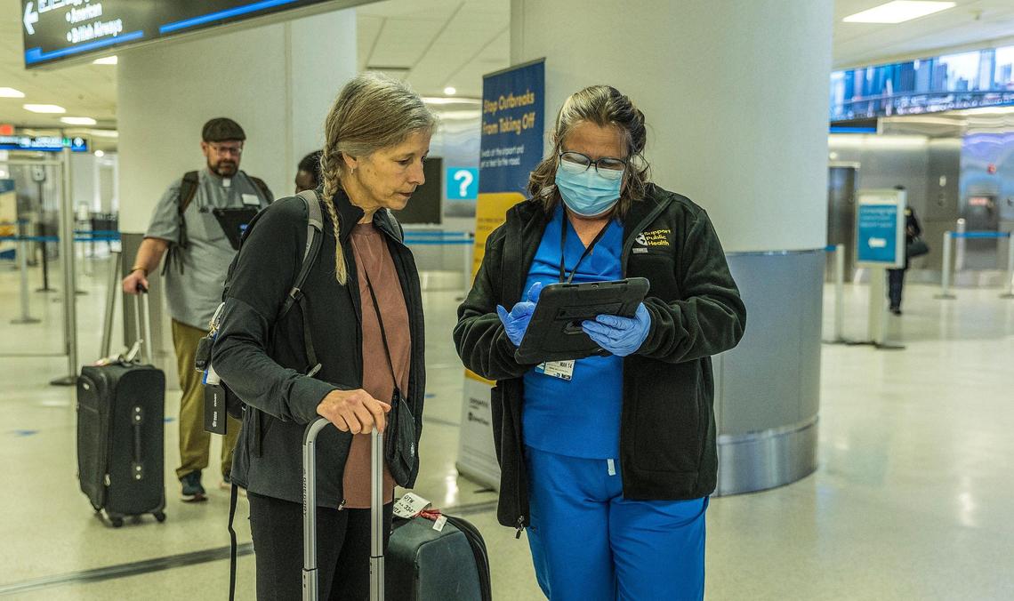 Bio surveillance specialist Talia Estevez assists traveler Julie Huellmantel arriving from Cuba before she swabs her nose for a voluntary test as some travelers flying into Miami from other countries are being asked to do a nose swab to test for COVID variants and other contagious viruses as part of a nationwide effort to track new and emerging infectious diseases, on Thursday, March 14, 2024.