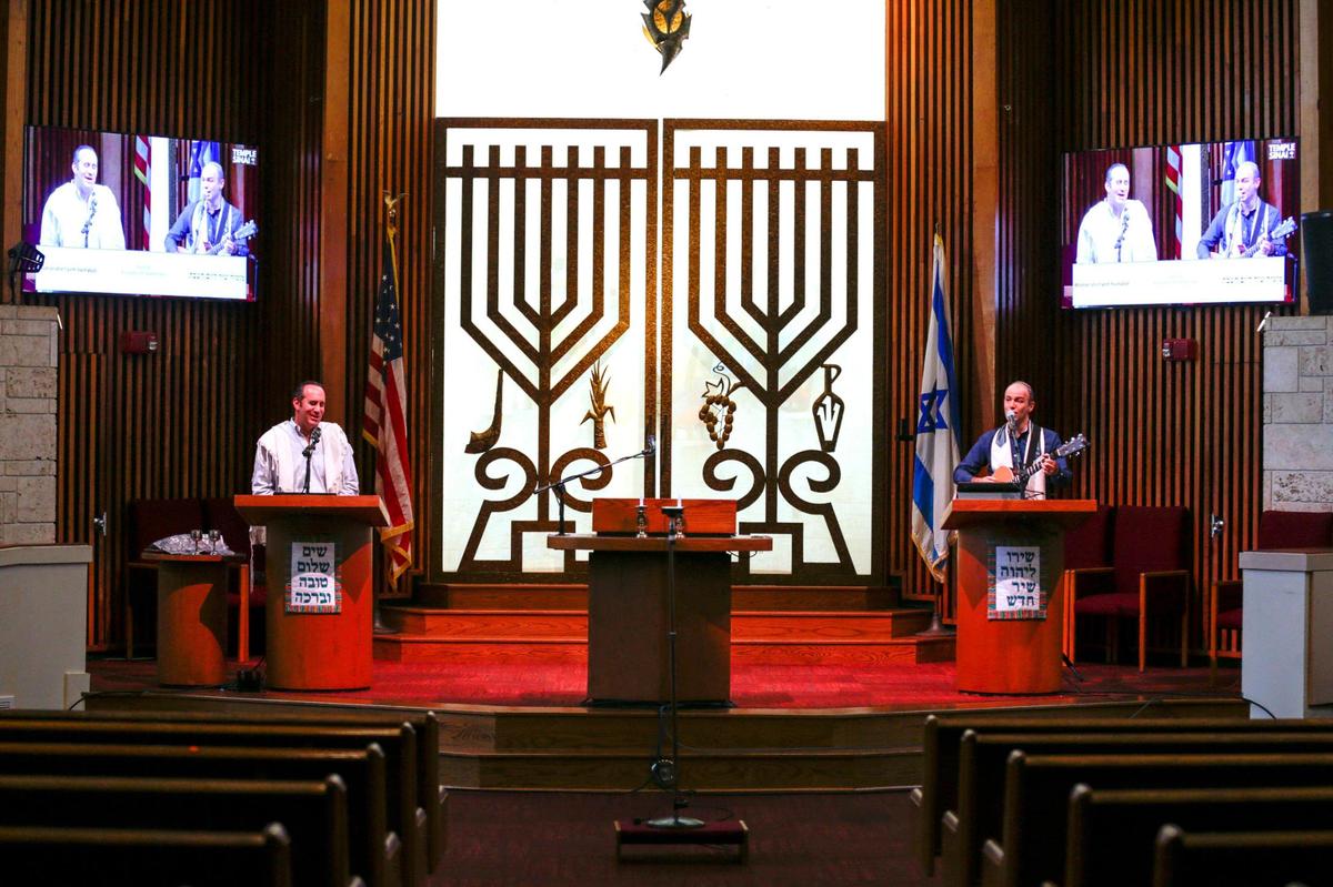 Rabbi Alan Litwak, left, and cantor Norman Cohen-Falah sing inside an empty synagogue Aug. 27, 2021, during an online service for worshipers to stream live from home as the Temple Sinai of North Dade prepares for the Jewish High Holidays services in times of Covid-19.