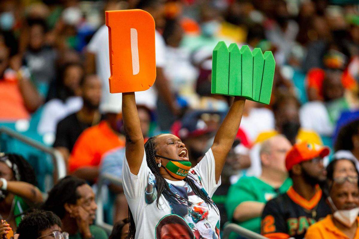 A FAMU fan holds up a foam ‘D-Fence’ in the crowd during the first quarter of the Orange Blossom Classic against Jackson State University at Hard Rock Stadium in Miami Gardens, Florida, on Sunday, Sept. 5, 2021.