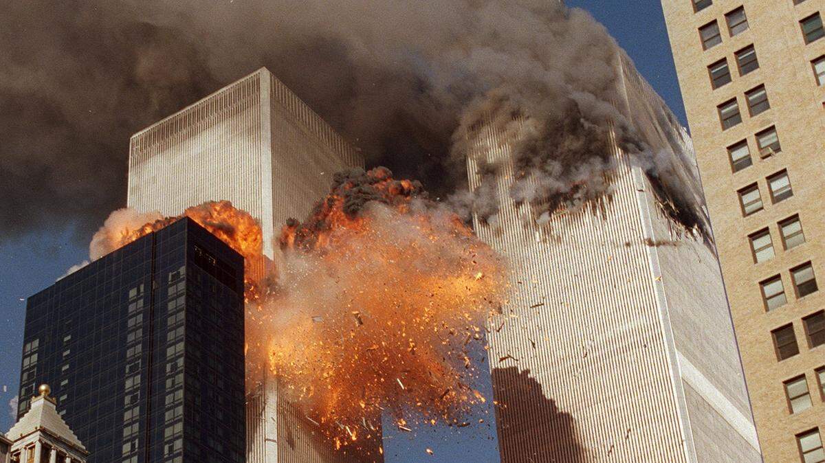 Smoke billows from one of the towers of the World Trade Center and flames and debris explode from the second tower on Sept. 11, 2001. In one of the most horrifying attacks ever against the United States, terrorists crashed two airliners into the World Trade Center in a deadly series of blows that brought down the twin 110-story towers.
