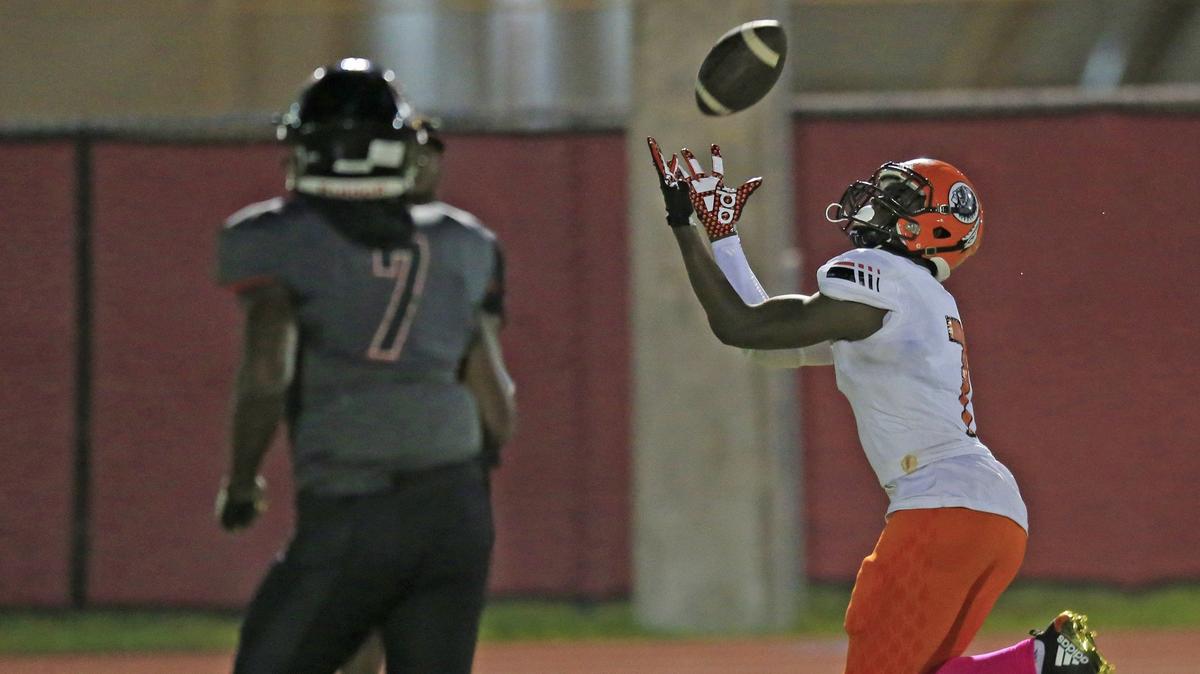 Carol City’s wide receiver Thaiu Jones-Bell (7) receives a pass for a touchdown as Southridge’s Tyrique Stevenson (7) gives chase in the first half as Soutridge High School hosts Carol City in Miami on Friday, October 5, 2018.
