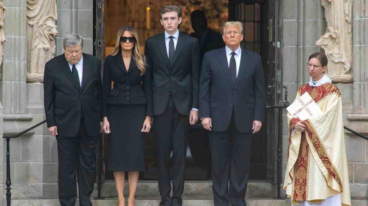 Viktor Knavs (from left), Melania Trump, Barron Trump, former President Donald Trump and Bethesda-by-the-Sea Rector the Rev. Tim Schenck await the arrival of the casket of Amalija Knavs at the church on Thursday.
