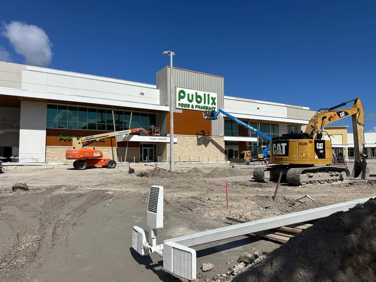 Construction crews work on the storefront of a new build Publix set to replace an old store at the Briar Bay Shopping Plaza across the street from The Falls in South Miami-Dade on Nov. 1, 2024. The mall anchor store, which will be two stories and about 53,000 square feet, opens Feb. 27, 2025, at 13005 SW 89th Place.