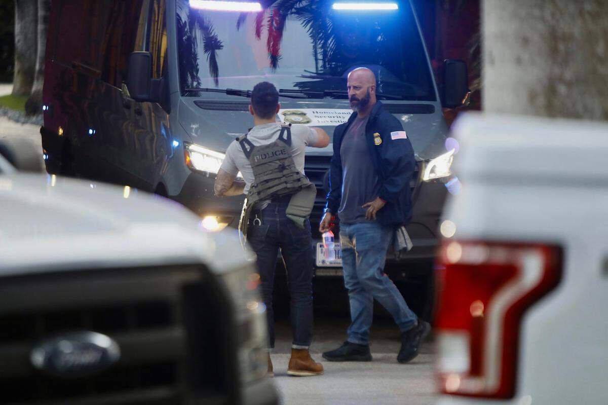 Federal agents stand outside the 2 Star Island Drive mansion owned by Sean ‘Diddy’ Combs on Monday, March 25, 2024, in Miami Beach, Florida. On Tuesday, Sept. 17, 2024, federal prosecutors in New York unsealed an indictment alleging Diddy “engaged in a persistent and pervasive pattern of abuse toward women and other individuals.”&nbsp;He has pleaded non guilty.