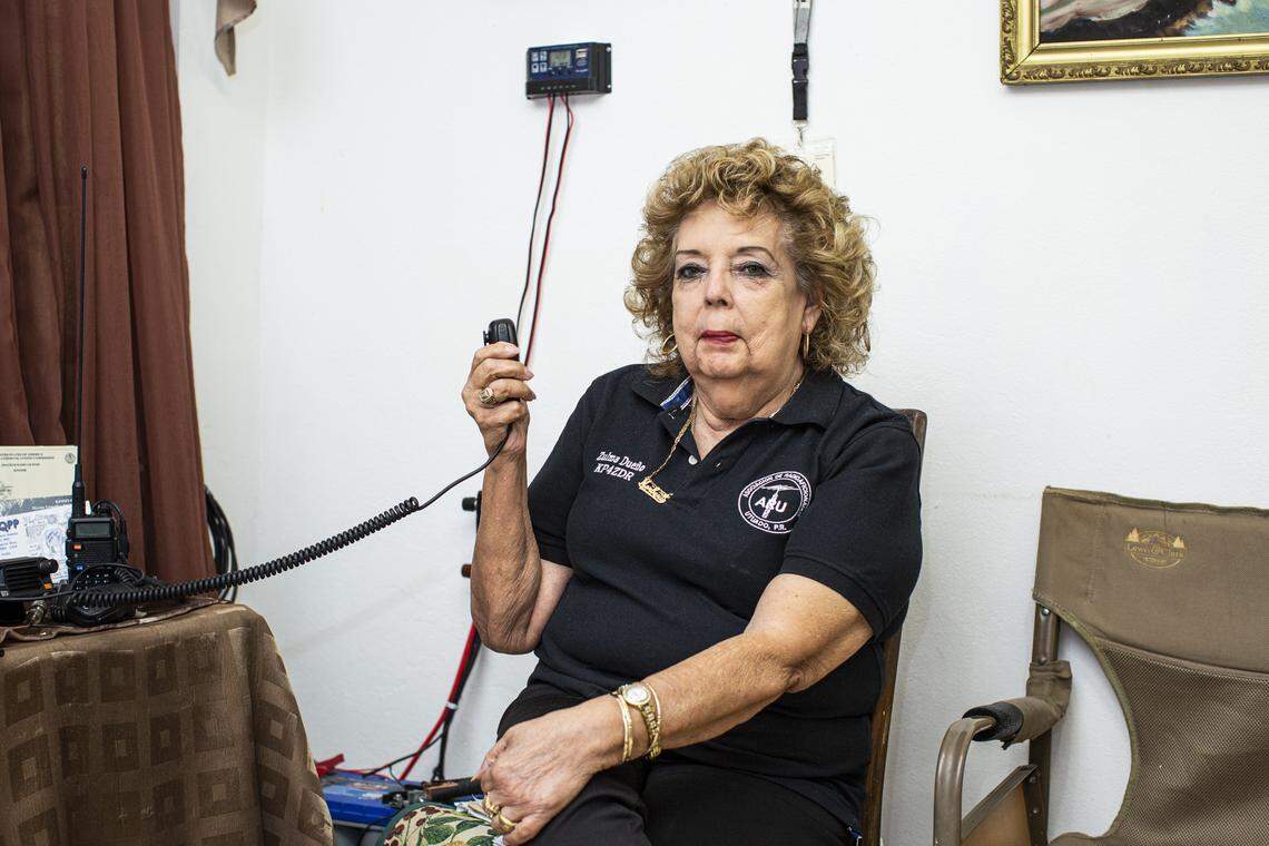 Zulma Dueño, a KP4 radio amateur, poses for a portrait at home on June 4, 2021, in Utuado, Puerto Rico. Dueño spent a week trapped inside her home after Hurricane Maria. After that, she became one of the registered radio aficionados in the group founded by Pedro Labayen.