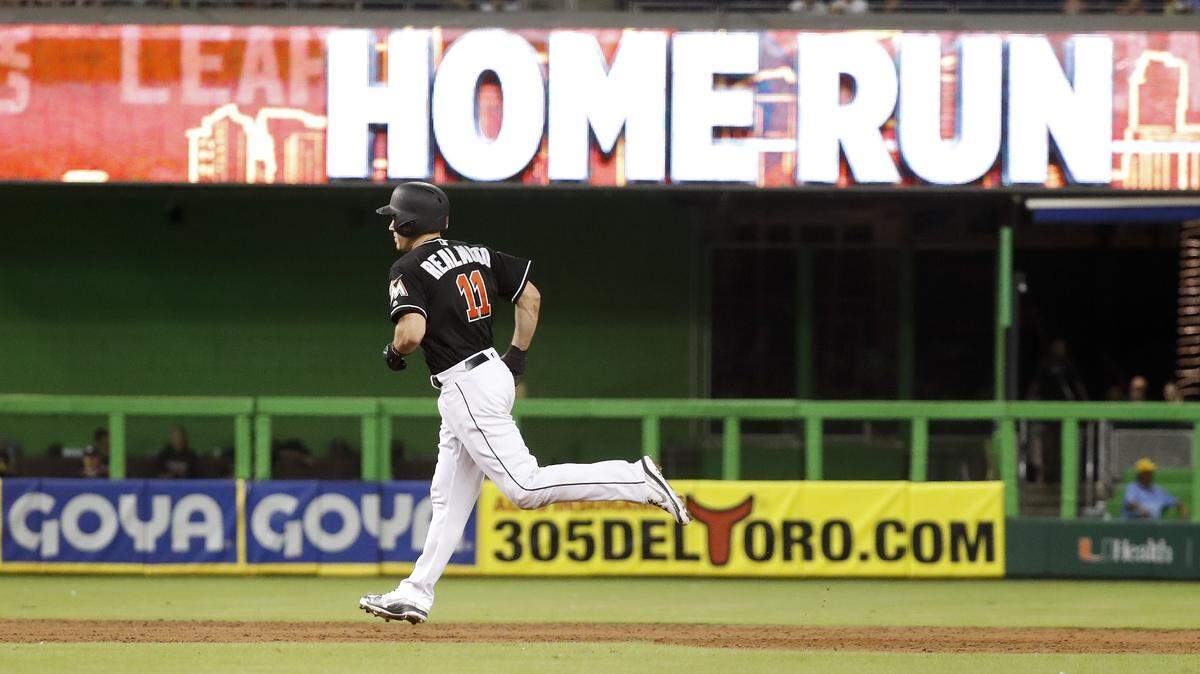 Miami Marlins’ J.T. Realmuto runs toward third base after hitting a solo home run during the third inning of a baseball game against the Toronto Blue Jays, Saturday, Sept. 1, 2018, in Miami. (AP Photo/Brynn Anderson)