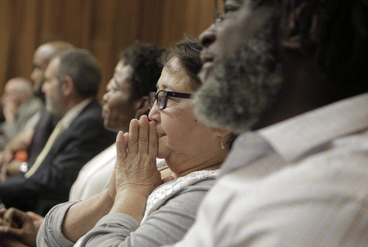 Gladys Soto, center, mother of Arnaldo Rios Soto, reacts during closing arguments in the Jonathon Aledda trial on March 14, 2019. Aledda, a North Miami police officer, shot her son’s caregiver, Charles Kinsey. To the right of the frame is Kinsey, who sat next to her during the closing arguments.