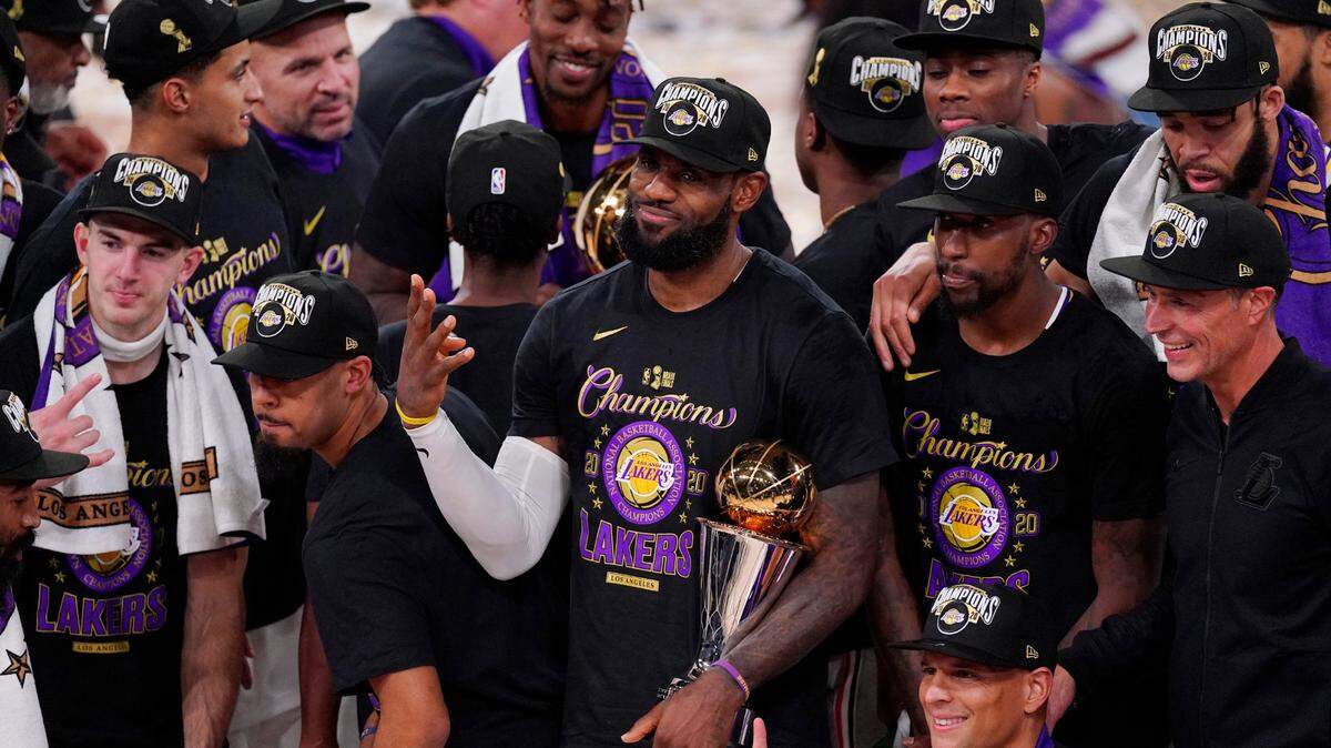 Los Angeles Lakers’ LeBron James (23) celebrates with his teammates after the Lakers defeated the Miami Heat 106-93 in Game 6 of basketball’s NBA Finals Sunday, Oct. 11, 2020, in Lake Buena Vista, Fla. 