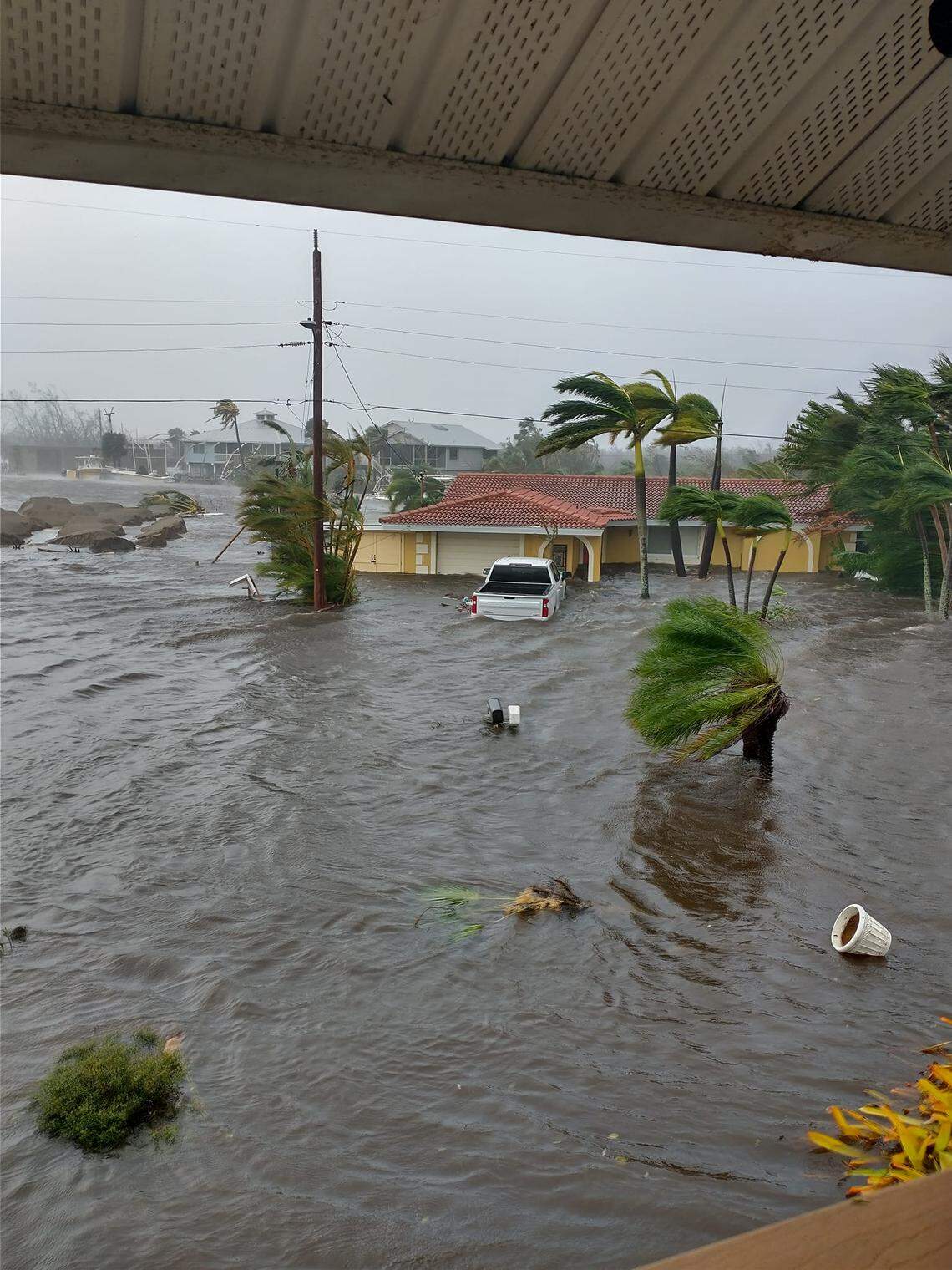 The storm surge barrels through St. James City in Pine Island, Florida, on Wednesday afternoon, Sept. 28, 2022. Hurricane Ian hit Southwest Florida as a powerful Category 4 storm.