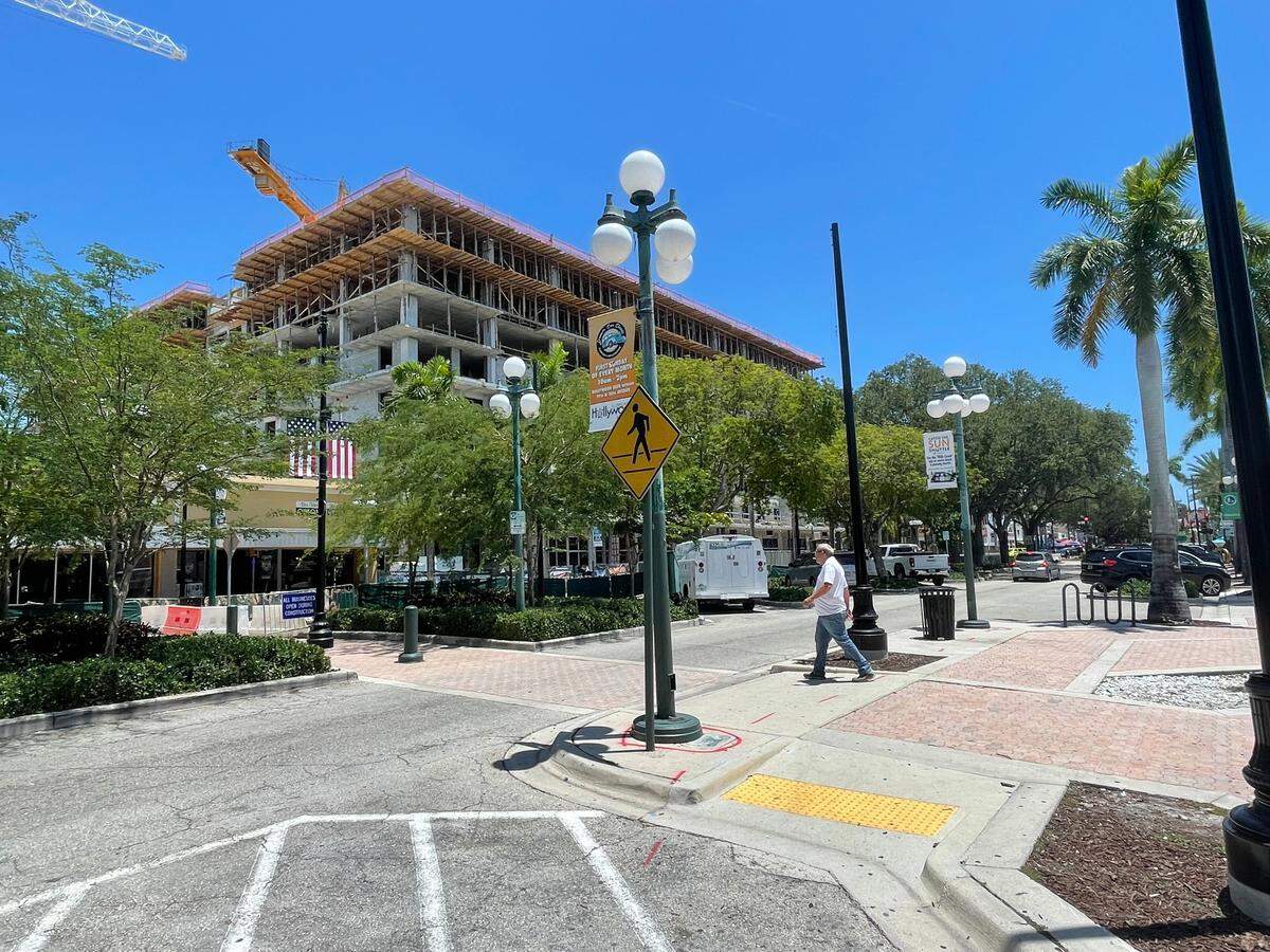 A man crosses Hollywood Boulevard in Hollywood, Florida on May 9, 2023.