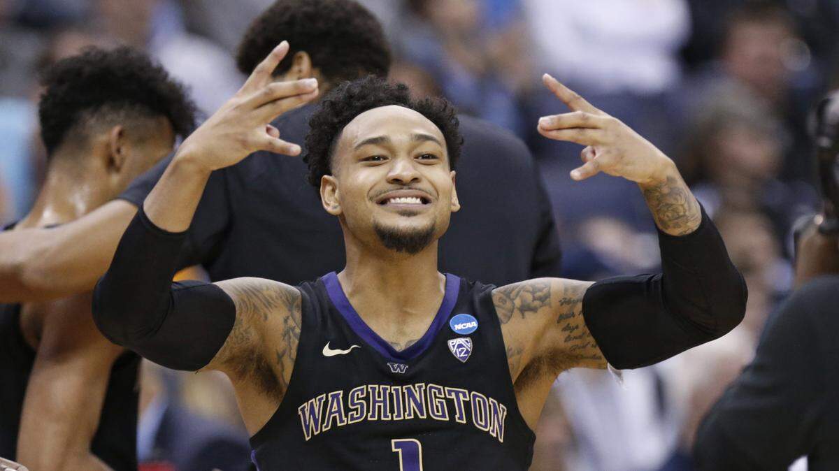 Washington’s David Crisp celebrates after his team defeated Utah State during a first round men’s college basketball game in the NCAA Tournament in Columbus, Ohio, Friday, March 22, 2019.