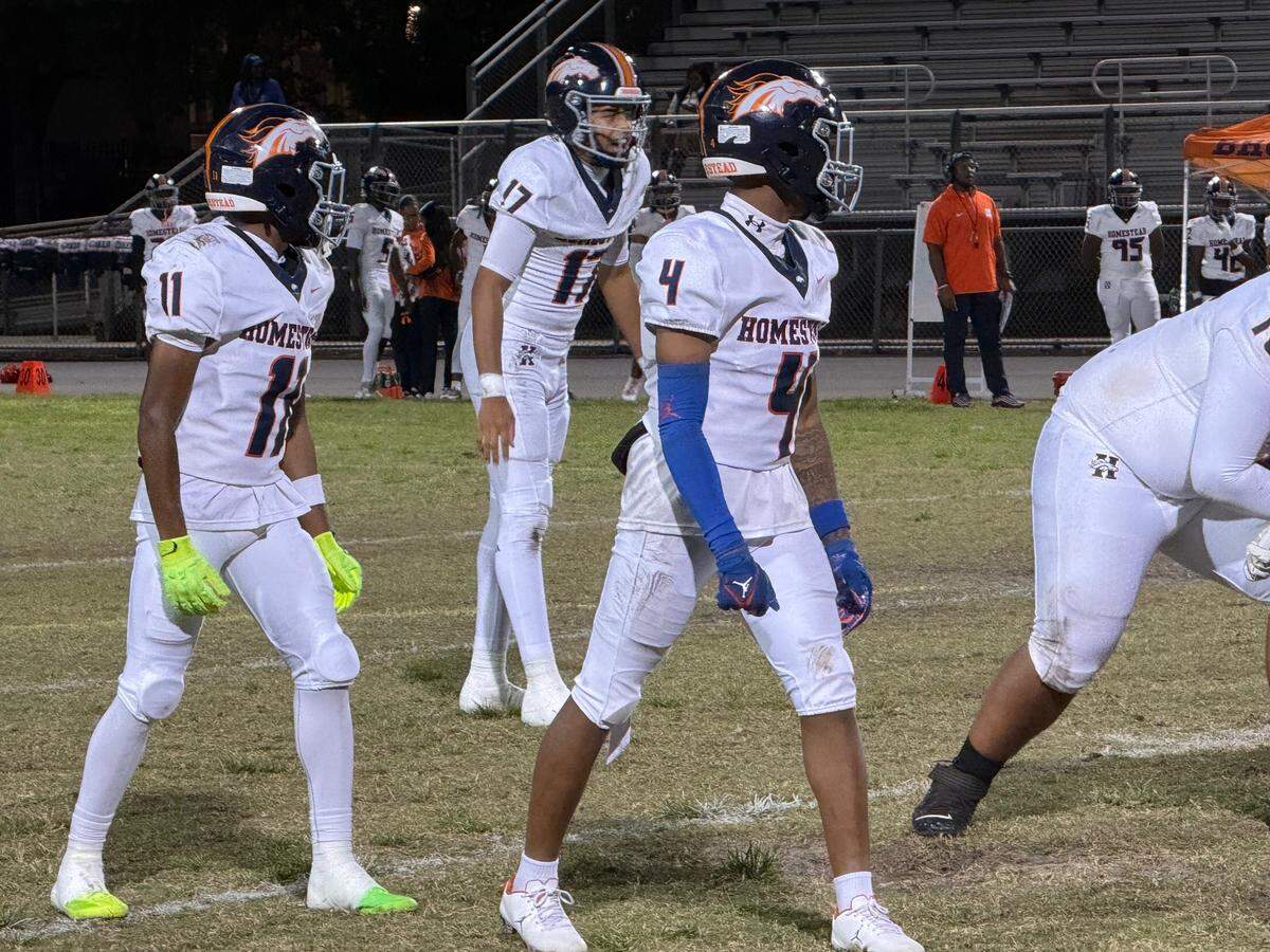 Homestead quarterback Malachi Lewis (No. 17, center) passed for three touchdowns in a 28-21 loss to Monarch in a Region 4-6A quarterfinal on Friday at Coconut Creek High.