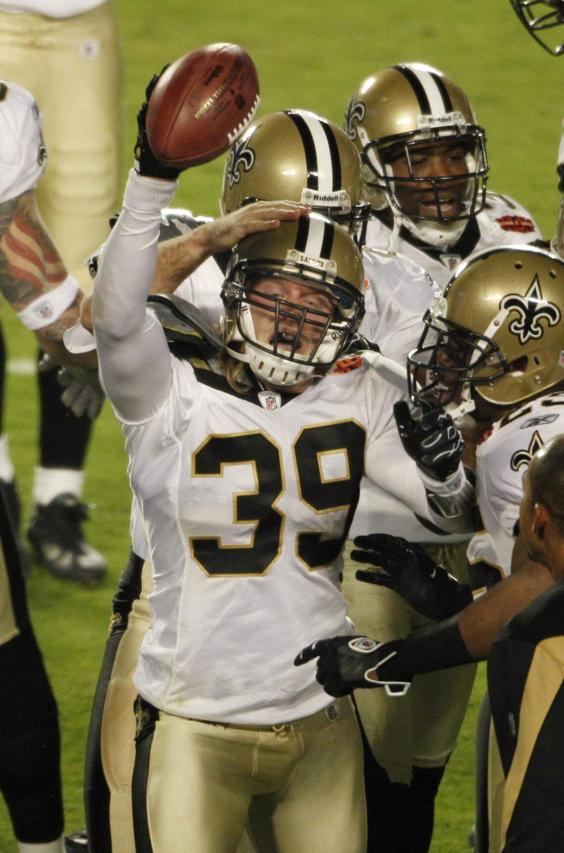 New Orleans Saints safety Chris Reis (39) celebrates with teammates after recovering an onside kick to start the second half of the NFL Super Bowl XLIV football game against the Indianapolis Colts in Miami, Sunday, Feb. 7, 2010. (AP Photo/J. Pat Carter)