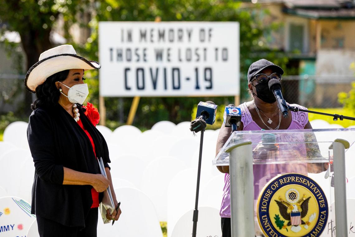 Congresswoman Frederica Wilson looks on as Miami-Dade resident Wanda McKinney gives her testimony regarding the death of her brother due to COVID-19, during an event to unveil an expanded memorial cemetery in Liberty City’s Simonoff Park, in memory to those lost to coronavirus, and conduct a ceremonial ribbon cutting for new COVID-19 testing site established at the nearby Jessie Trice Community Health System (JTCHS) in partnership with Florida International University to serve Miami-Dade County’s most vulnerable communities, in Liberty City, Florida, on Tuesday, November 24, 2020.