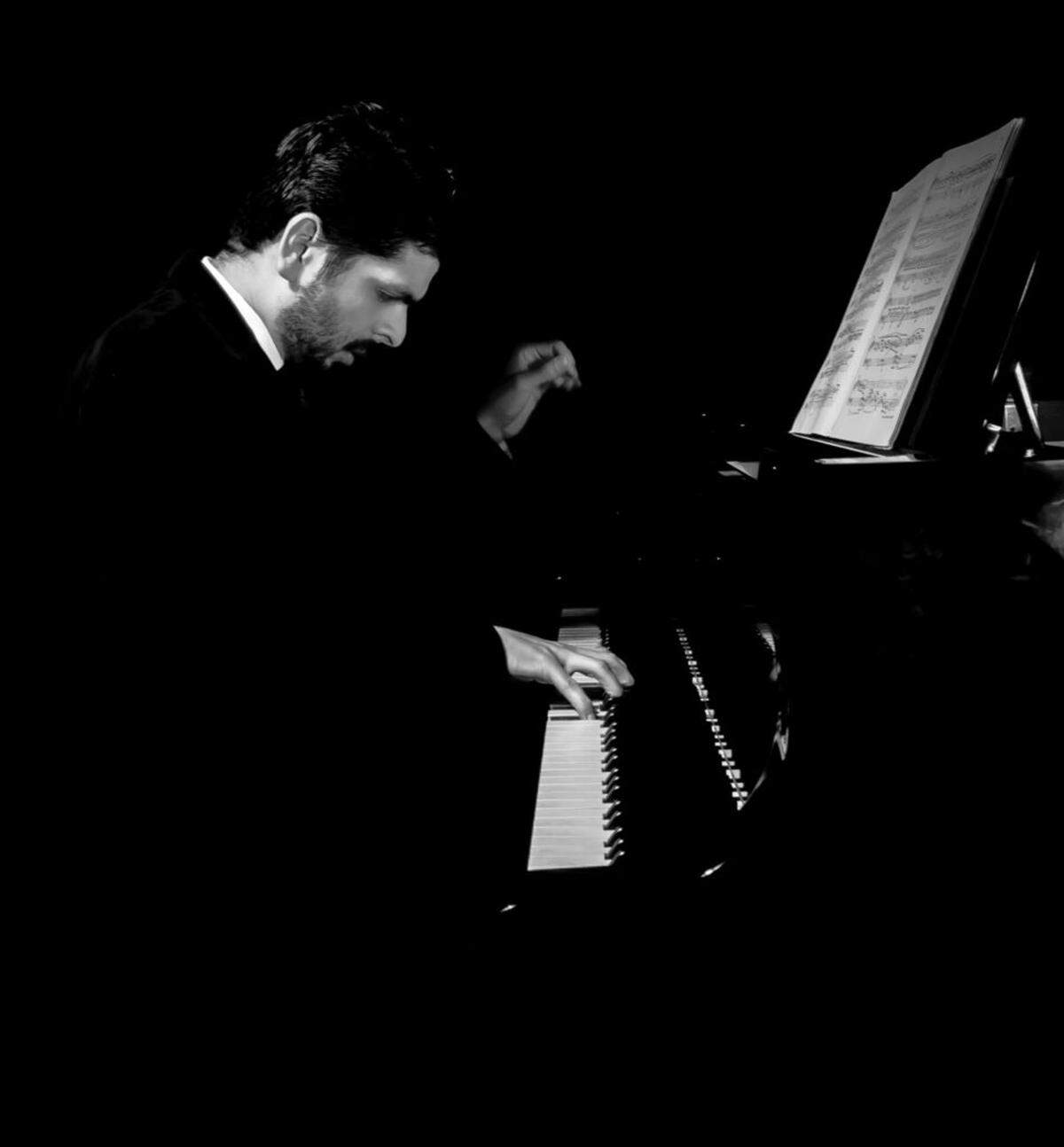 Kristhyan Benítez performs at the piano. Benítez is a co-creator of “A Fuego Lento,” which makes its North American premiere in Miami.