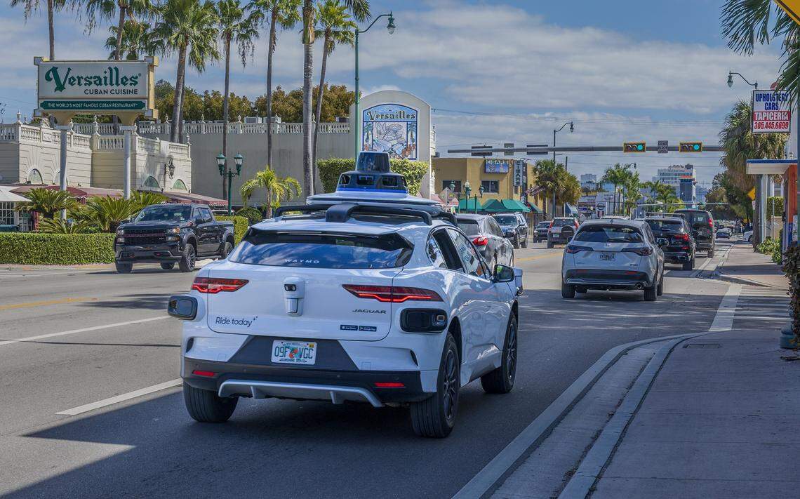 View of a Waymo self driving car at SW 8 Street, approaching the iconic Versailles Cuban Cuisine Restaurant, with Miami Herald reporters Catherine Odom and Michael Butler, onboard, as they head to the Brickell Centre, to test the Waymo-Self-Driving Cars - Autonomous Vehicles - Ride-,on Wednesday, February 25, 2026.