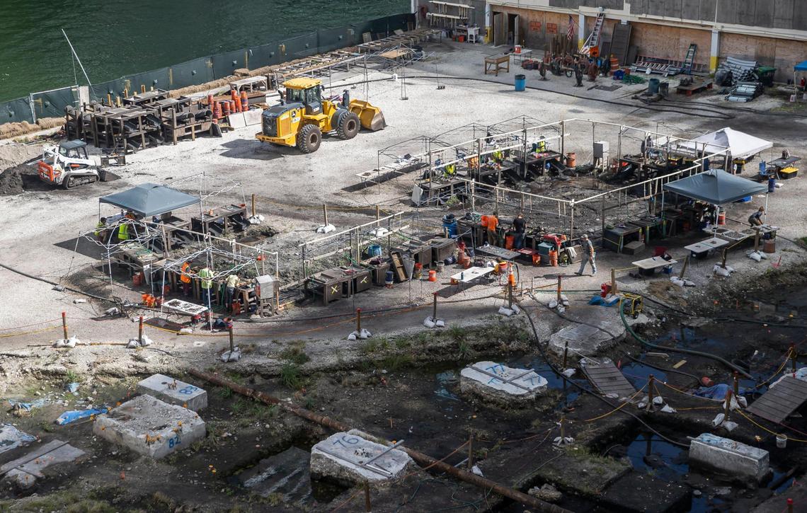 People are seen working an archaeological dig site located near Brickell on the Miami River on Monday, Jan. 30, 2023, in Miami. Artifacts going back 7,000 years have been found at the site, along with postholes, grave sites, human remains and other evidence of substantial settlement by the Tequesta Native American tribe.