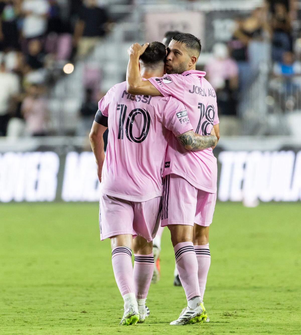 Inter Miami forward Lionel Messi (10) celebrates with defender Jordi Alba (18) after scoring a goal against Charlotte FC in the second half of their Leagues Cup quarterfinal match at DRV PNK Stadium on Friday, Aug. 11, 2023, in Fort Lauderdale, Fla.
