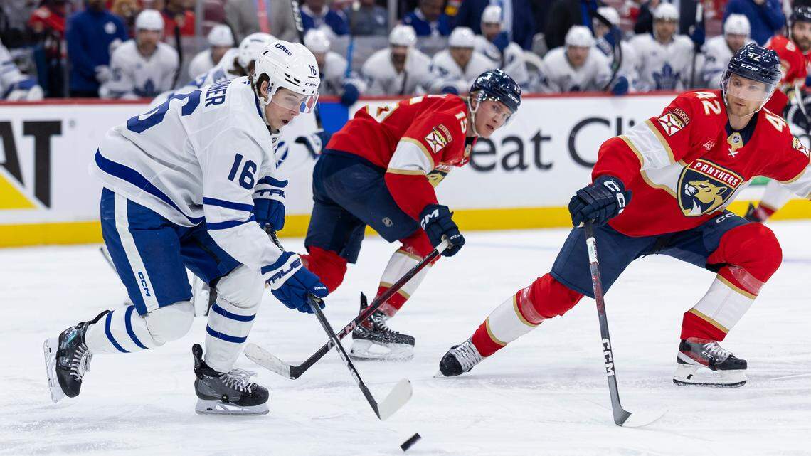 Toronto Maple Leafs right wing Mitch Marner (16) skates with the puck as Florida Panthers defenseman Gustav Forsling (42) defends in the third period of Game 3 of a second-round Stanley Cup playoffs series at the Amerant Bank Arena on Friday, May 9, 2025, in Sunrise, Fla.
