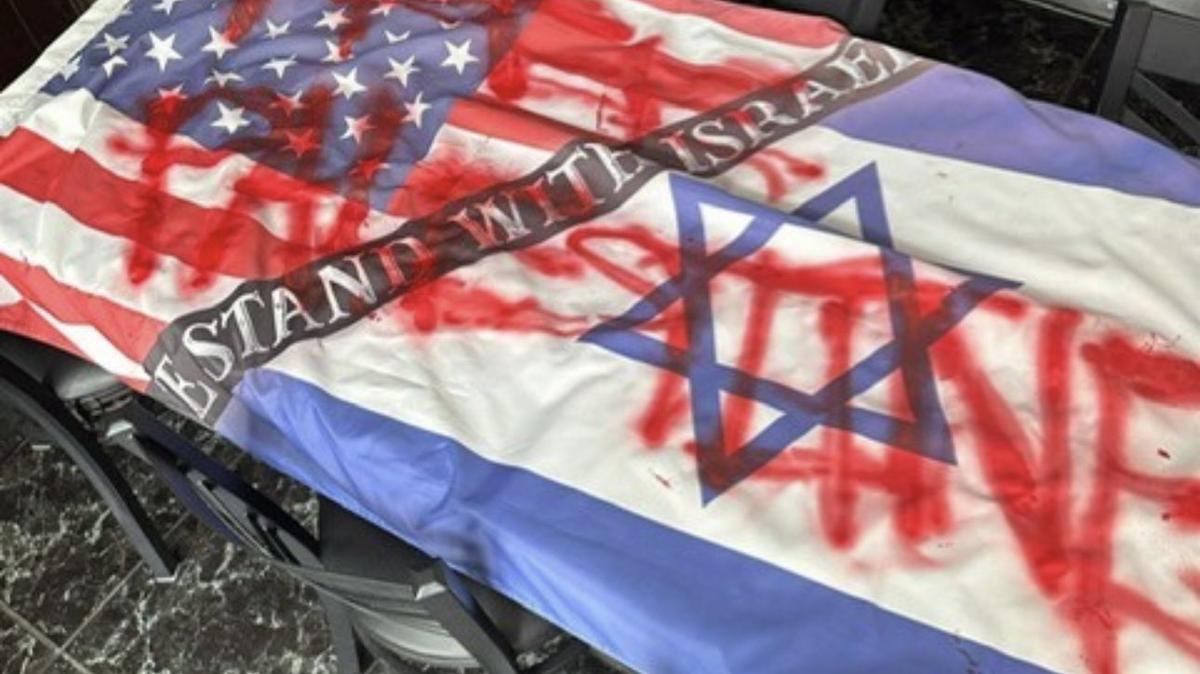 A U.S./Israeli flag is vandalized with ‘Free Palestine.’ The flag was hanging outside Holy Bagels & Pizzaria when it was torn down June 16, 2024.